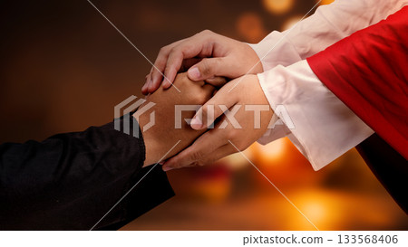 Jesus Christ hand offering a helping hand with blurred bokeh light background. Concept of Christianity, religious, faith, Jesus, or belief 133568406