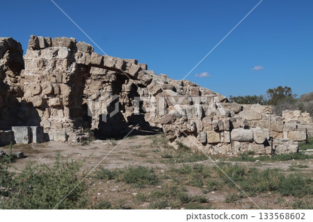 Salamis ruderi romani cipro ancient roman ruins forming an arch under blue sky. Salamis ruderi romani cipro Salamis ruderi romani cipro ancient roman ruins forming an arch under blue sky. Salamis ruderi romani cipro 133568602