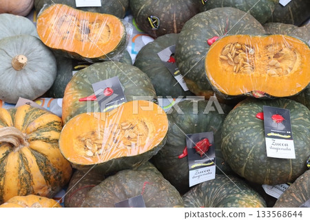 Italian pumpkins and squash at market for sale 133568644