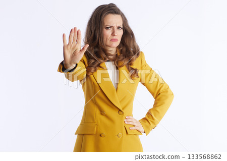 Assertive Businesswoman Giving a Stop Hand Gesture Assertive Businesswoman Giving a Stop Hand Gesture 133568862