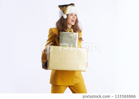 Joyful Businesswoman Celebrating with Christmas Gifts Joyful Businesswoman Celebrating with Christmas Gifts 133568866