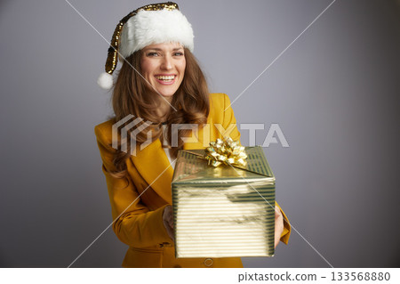 Business Leader Extending Golden Christmas Present 133568880