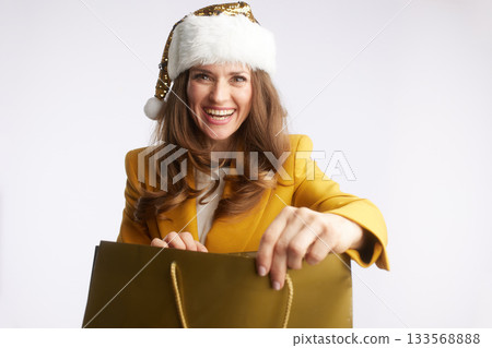 Businesswoman Reaches Into Festive Gold Bag 133568888