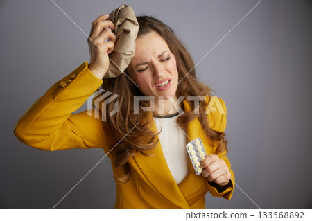 Businesswoman Taking Medicine for Relief Businesswoman Taking Medicine for Relief 133568892