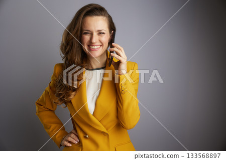 Businesswoman Smiling While on Smartphone Call 133568897