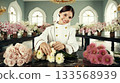 Cute smiling east asian female seller organizing pastel chrysanthemums and orchids on a marble-top counter. Serene flower boutique. Natural lighting. 133568939