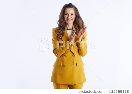 Confident Professional Applauds Success with a Smile 133569118