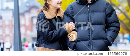 Men and women laughing with arms crossed Men and women laughing with arms crossed 133569976