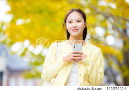 Autumn leaves, smartphone, woman Autumn leaves, smartphone, woman 133570024
