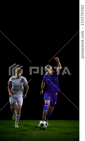Female soccer players sprinting in fast attack toward ball Female soccer players sprinting in fast attack toward ball 133570382