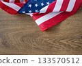 United States flag on wooden backdrop with copy space, great for banners, posters, and digital designs for patriotic events such as Independence Day, Veterans Day, Labor Day,Memorial Day. 133570512