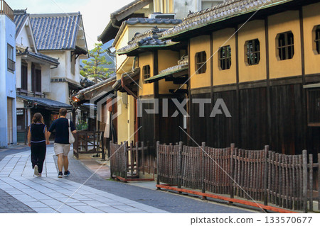 Foreigners strolling through the quaint Takehara Town Preservation District Foreigners strolling through the quaint Takehara Town Preservation District 133570677