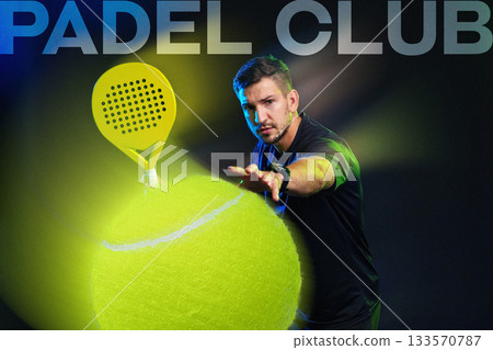 Exciting padel action featuring a player serving at a vibrant padel club venue 133570787