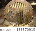 Heavily corroded, soiled heat exchanger plate with numerous circular tubes. The metallic surface shows signs of rust, residue, damage, indicating need for maintenance or replacement. MP-65 Oil Cooler 133570915