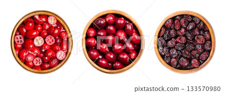 Fresh and dried large American cranberries, Vaccinium macrocarpon, in wooden bowls. To the left sliced and freeze-dried, fresh and ripe berries in the center, to the right dried and sweetened. Photo Fresh and dried large American cranberries, Vaccinium macrocarpon, in wooden bowls. To the left sliced and freeze-dried, fresh and ripe berries in the center, to the right dried and sweetened. Photo 133570980