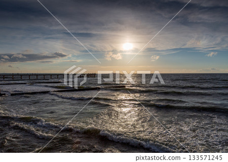 Curonian Spit wth Baltic sea coastline on sunset 133571245