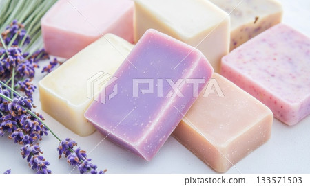 Lavender adorned handmade soap bars displaying vibrant colors and natural ingredients, evoking serene wellness and artisan skincare elegance against pristine background 133571503