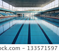 A swimming pool for competitions. Blue water and stands 133571597