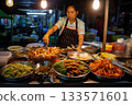 A Thai street food vendor working at night 133571601