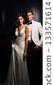 An Elegant Fashionable Bride and Groom Dressed in Stunning Evening Wear for a Special Occasion 133571614