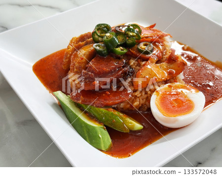 A savory dish of barbecued red pork in rich sauce A savory dish of barbecued red pork in rich sauce 133572048