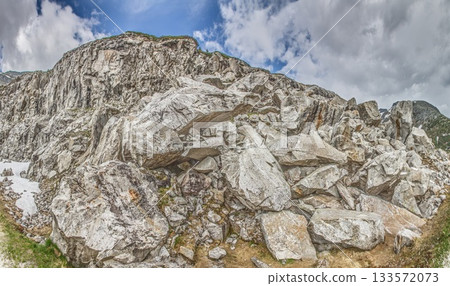 Panoramic view of rocky alpine slope and massive boulder field Panoramic view of rocky alpine slope and massive boulder field 133572073