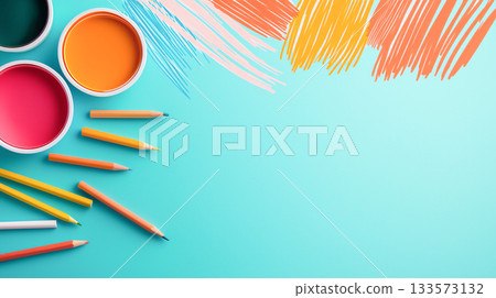 Bright paints and colored pencils on vibrant turquoise background 133573132