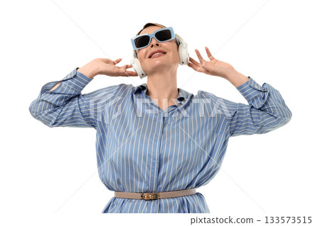 Woman listens to music while wearing headphones, isolated on white, PNG 133573515