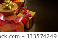 Luxury Gift Boxes with Golden and Red Ribbons 3d render. 133574249