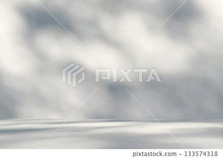 Abstract white studio room with light and shadow from window and tree leaves background for product display presentation Abstract white studio room with light and shadow from window and tree leaves background for product display presentation 133574318