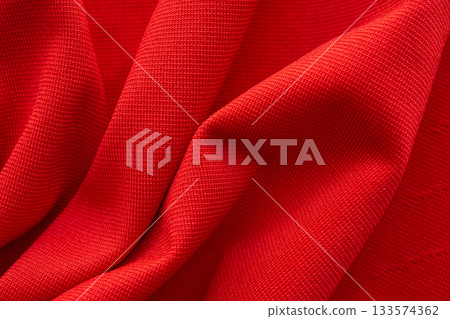 Red sports clothing fabric football shirt jersey texture close up Red sports clothing fabric football shirt jersey texture close up 133574362