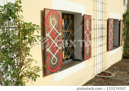Traditional European House Windows with Shutters 133574507
