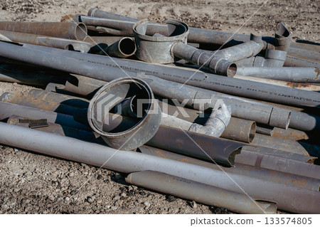 PVC pipes removed during demolition work 133574805
