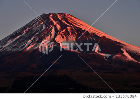 Mount Fuji and the Hoei crater bathed in the morning sun from the Torigoki Plateau Observatory on Mount Echizen in the Aitaka Mountains 133576084