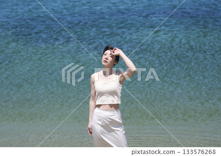 Woman enjoying a refreshing summer day 133576268