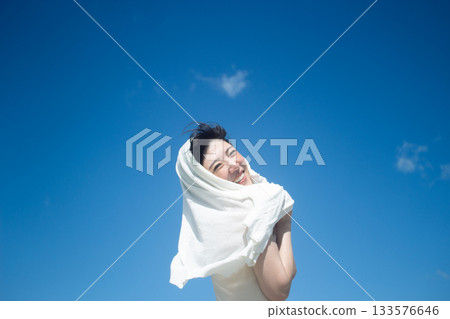 Image of a positive smile and a blue summer sky 133576646