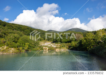 The blue-green surface of Jigoku-numa Pond in Mount Hakkoda The blue-green surface of Jigoku-numa Pond in Mount Hakkoda 133576832