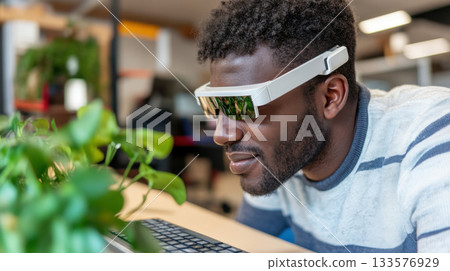 Blind employee using a braille keyboard and screen reader headset in a bright coworking space Blind employee using a braille keyboard and screen reader headset in a bright coworking space 133576929