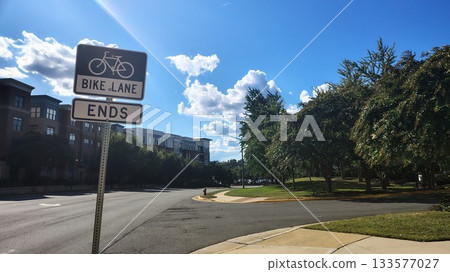 Chantilly, VA, USA - 10.22025: A combination road sign indicating the presence of a bike lane and the end of the road at a street fork with a right turn in a small American town, navigation for driver 133577027