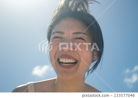 A woman looking up at the sky A woman looking up at the sky 133577046