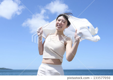 A woman relaxing on the coast 133577050