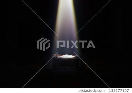 A large star announcing the birth of baby Jesus illuminates Jesus in a manger, Christmas and New Year background. 133577597