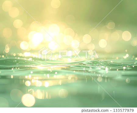 鼠尾草綠色的水面和散景背景反射著柔和的晨光 133577979