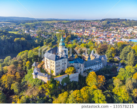 Chateau and Castle Frydlant on sunny autumn day. Frydlant v Cechach, Czech Republic. Aerial view from drone. Chateau and Castle Frydlant on sunny autumn day. Frydlant v Cechach, Czech Republic. Aerial view from drone. 133578215
