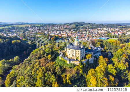 Chateau and Castle Frydlant on sunny autumn day. Frydlant v Cechach, Czech Republic. Aerial view from drone. Chateau and Castle Frydlant on sunny autumn day. Frydlant v Cechach, Czech Republic. Aerial view from drone. 133578216