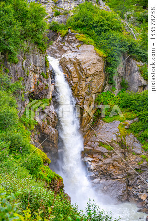 Wild alpine waterfall on Schlatenbach mountain stream. Gschloesstal Valley, Hohe Tauern National Park, East Tyrol, Austrian Alps Wild alpine waterfall on Schlatenbach mountain stream. Gschloesstal Valley, Hohe Tauern National Park, East Tyrol, Austrian Alps 133578238
