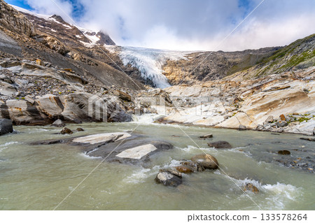 Mountain Glacier in alpine valley. Schlaten Glacier, German: Schlatenkees, Hohe Tauern National Park, East Tyrol, Austrian Alps Mountain Glacier in alpine valley. Schlaten Glacier, German: Schlatenkees, Hohe Tauern National Park, East Tyrol, Austrian Alps 133578264