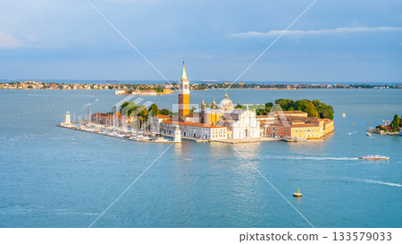 Aerial view of Saint George Island, Italian: Isola San Giorgio, with Campanile San Giorgio in Venetian Lagoon, Venice, Veneto Region, Italy. Photography on sunny summer day Aerial view of Saint George Island, Italian: Isola San Giorgio, with Campanile San Giorgio in Venetian Lagoon, Venice, Veneto Region, Italy. Photography on sunny summer day 133579033