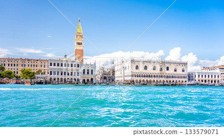 Venice historical center waterfront. Landmarks around St Mark Square with St Mark Campanile and Doge Palace. Sunny summer day in Venice, Italy. 133579071