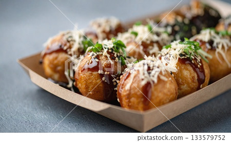 Fresh Takoyaki with Sauce and Toppings in Tray 133579752